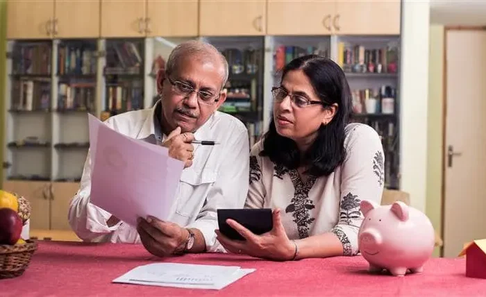 Income Tax Assessment Couple Reviewing Documents